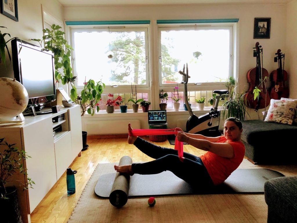 living room with person on gym mat. photo