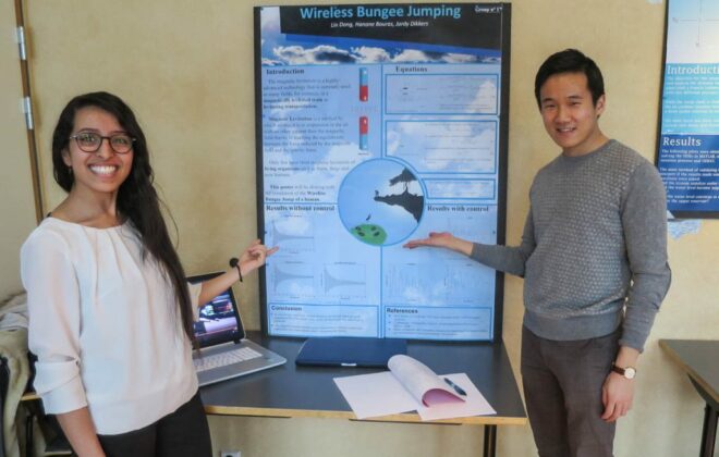 Students in front of science poster about wireless bungee jumping